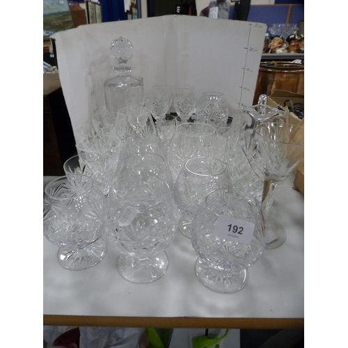 192 - Collection of cut glass to include decanters, jugs, brandy balloons etc.