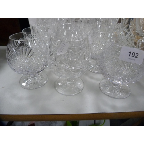 192 - Collection of cut glass to include decanters, jugs, brandy balloons etc.