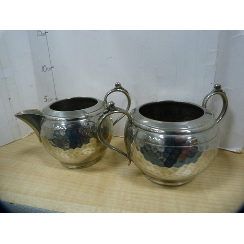 20 - Four-piece hammered pewter tea set.