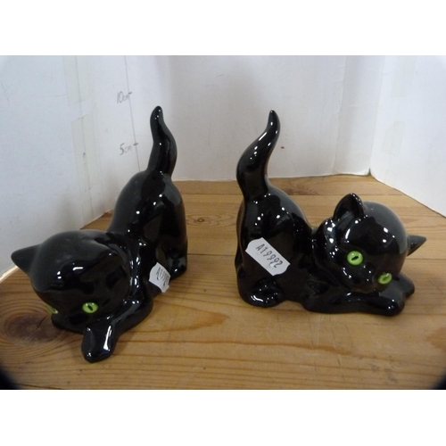 202 - Beswick model of a Dalmatian and three pottery cats.  (4)