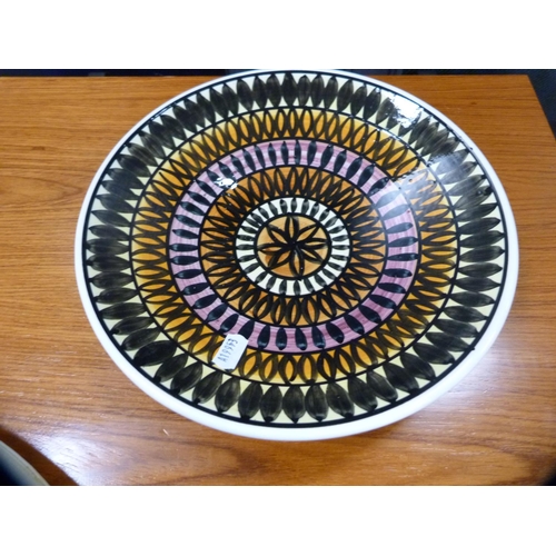 216 - Hand-decorated plate depicting a Zulu woman, a Jersey pottery bowl and an eastern bottle vase.