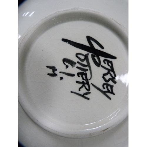 216 - Hand-decorated plate depicting a Zulu woman, a Jersey pottery bowl and an eastern bottle vase.