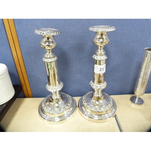 23 - Collection of EP to include a pair of candlesticks, sauce boat on stand, cream and sugar on stand, m... 