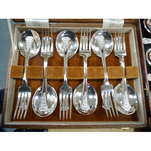 24 - Cased cutlery to include a set of six dessert forks with serving spoons, dessert spoons and forks.  ... 