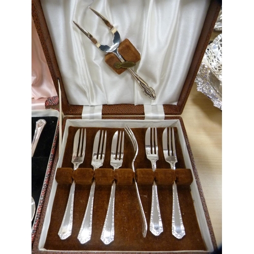 24 - Cased cutlery to include a set of six dessert forks with serving spoons, dessert spoons and forks.  ... 