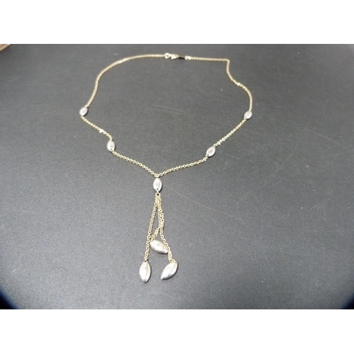 255 - 9ct yellow and white gold chain with pendant drop, 5.1g.