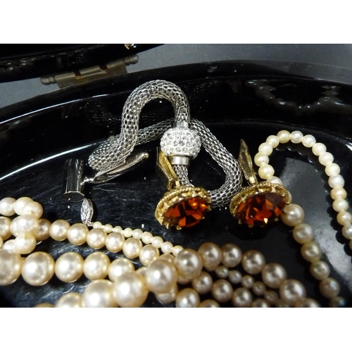 260 - Strings of faux pearls, costume cufflinks and costume pendants contained in a lacquered jewellery bo... 