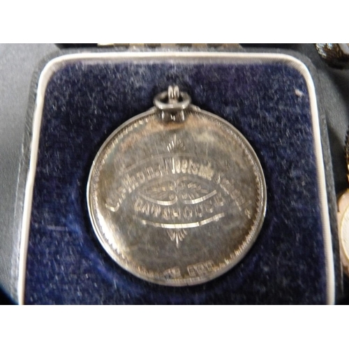 271 - Silver presentation medal, engraved and dated 1922/3, 25.6g, cased, and a vintage rolled gold lady's... 