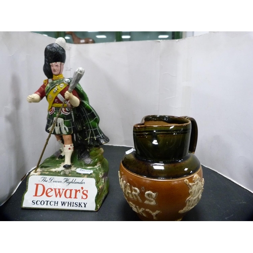 272 - Royal Doulton Dewar's Whisky jug and a Dewar's Highlander advertising figure.