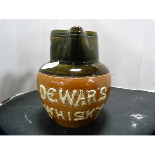 272 - Royal Doulton Dewar's Whisky jug and a Dewar's Highlander advertising figure.