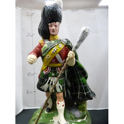 272 - Royal Doulton Dewar's Whisky jug and a Dewar's Highlander advertising figure.