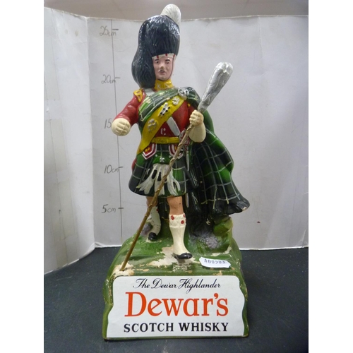 272 - Royal Doulton Dewar's Whisky jug and a Dewar's Highlander advertising figure.