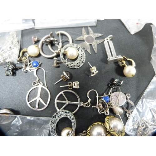 276 - Collection of silver and white metal jewellery, mainly earrings, pendants etc.