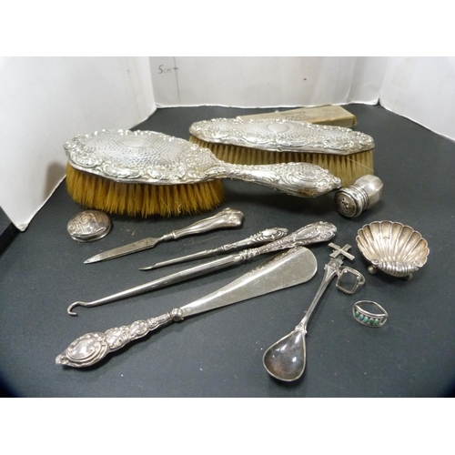 279 - Silver-backed lady's brush and clothes brush, button hook and shoe horn, continental silver spoon, s... 