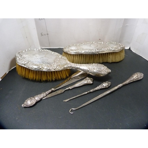 279 - Silver-backed lady's brush and clothes brush, button hook and shoe horn, continental silver spoon, s... 