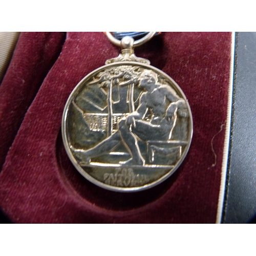 284 - Queen Elizabeth II Imperial Service medal with red and blue ribbon attachment, in Royal Mint box.