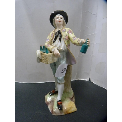 303 - Late 19th/early 20th century continental porcelain figure modelled as a wine seller, with crossed sw... 