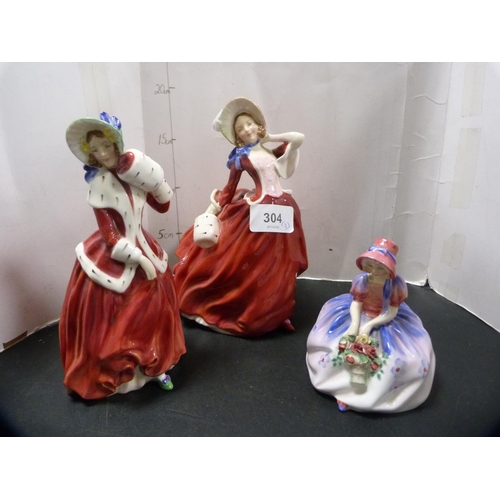 304 - Three Royal Doulton figures, 'Monica', 'Christmas Morn' and 'Autumn Breezes'.