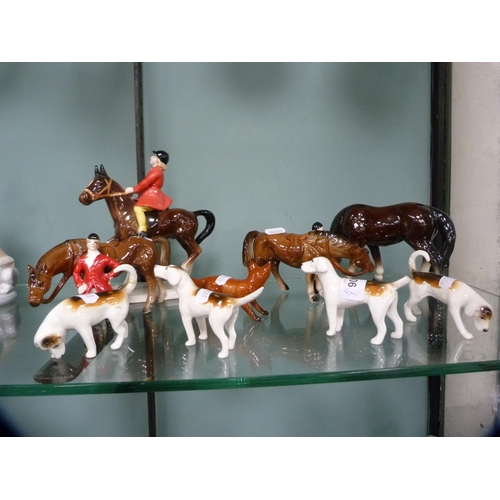 306 - Four Beswick hounds and a Beswick fox, together with other unmarked horses and riders.  (9)