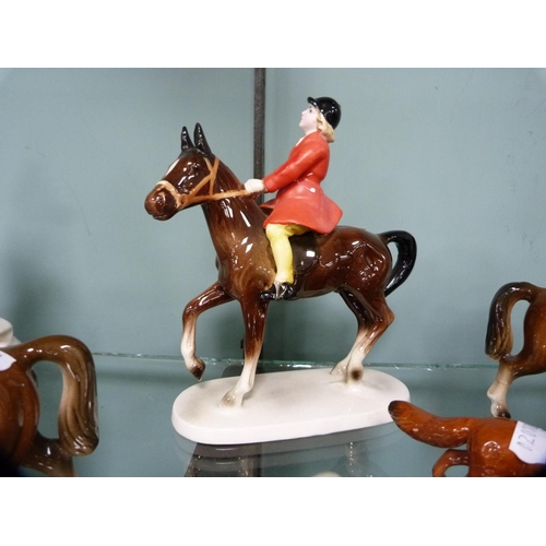 306 - Four Beswick hounds and a Beswick fox, together with other unmarked horses and riders.  (9)