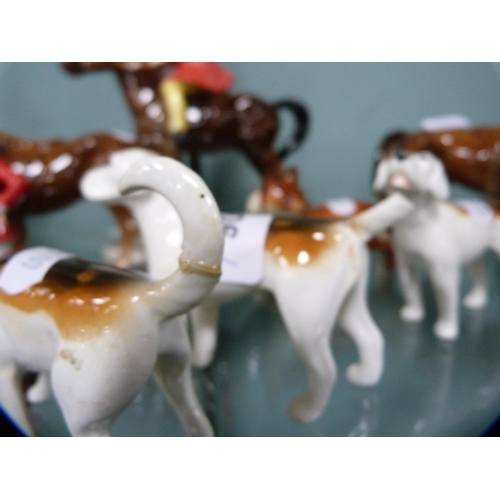 306 - Four Beswick hounds and a Beswick fox, together with other unmarked horses and riders.  (9)