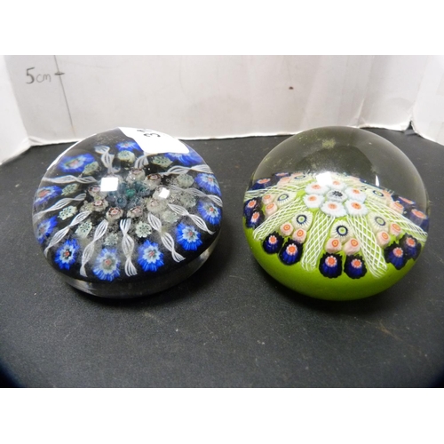 316 - Five assorted glass paperweights to include Caithness and others.