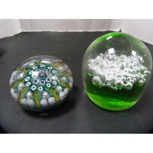 316 - Five assorted glass paperweights to include Caithness and others.