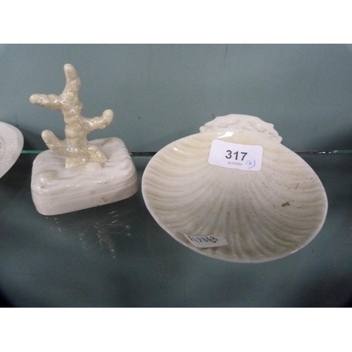 317 - Five pieces of Belleek porcelain to include a leaf-shaped dish, boat ornament, butter dish (black st... 