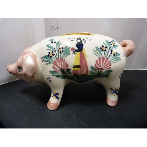 318 - Quimper coin bank modelled as a pig, initialled HB to the underside.