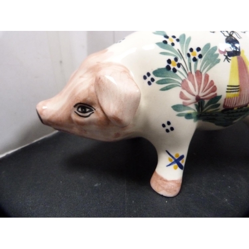 318 - Quimper coin bank modelled as a pig, initialled HB to the underside.