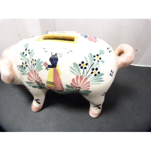 318 - Quimper coin bank modelled as a pig, initialled HB to the underside.