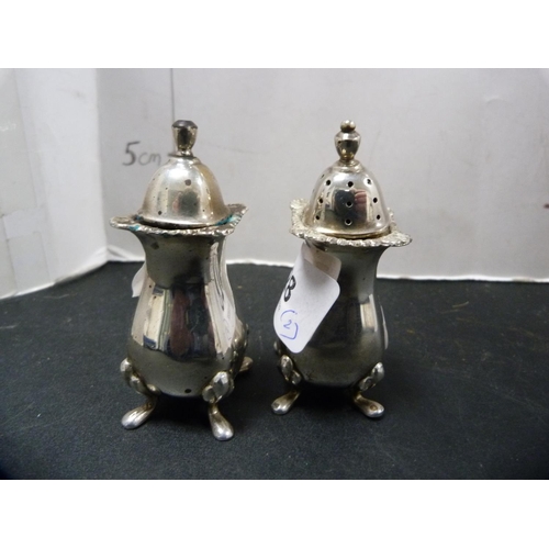 328 - Silver pepper pot and a similar salt, 91.5g gross.  (2)