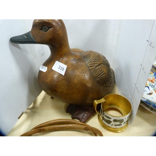 339 - Carved wooden duck and an enamel cup holder.