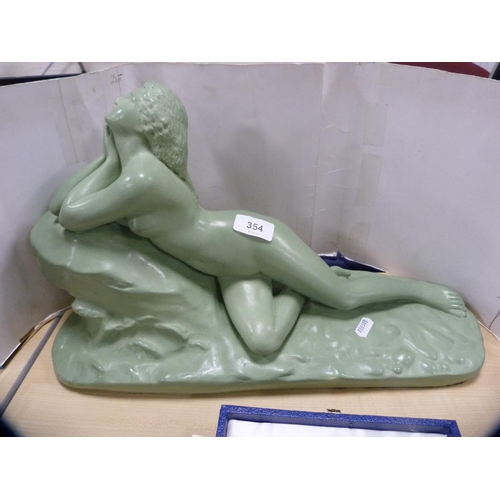 354 - Art Deco-style figure of a reclining maiden.