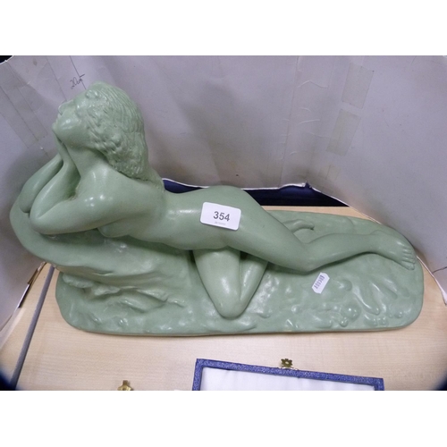 354 - Art Deco-style figure of a reclining maiden.