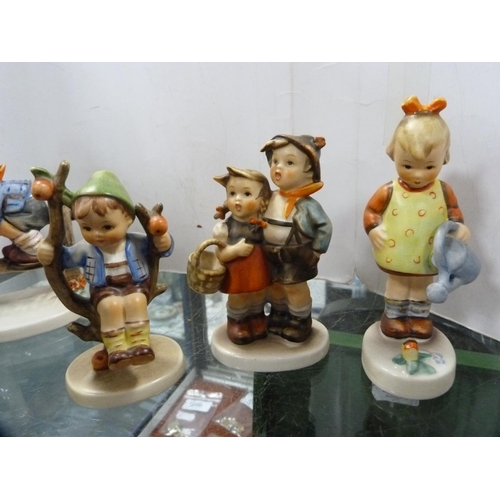 362 - Collection of Hummel figures and a toby jug.