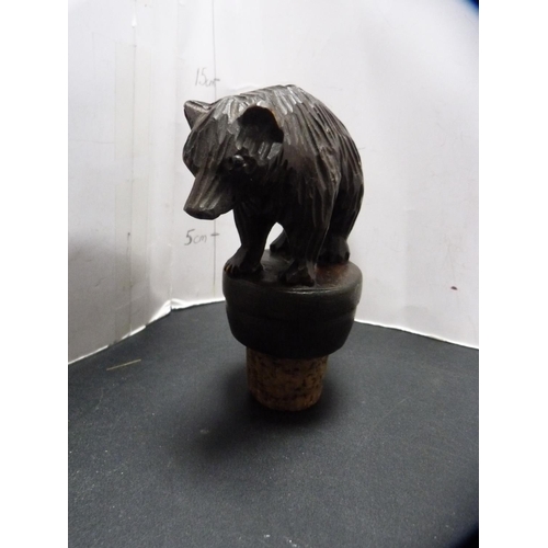 364 - Two Black Forest bear stoppers and a musical box.