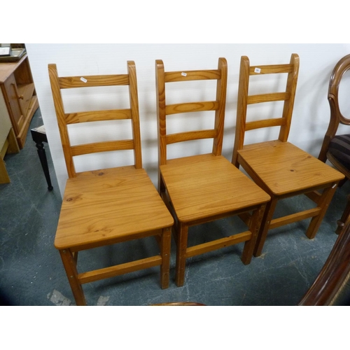 398 - Three pine kitchen chairs.