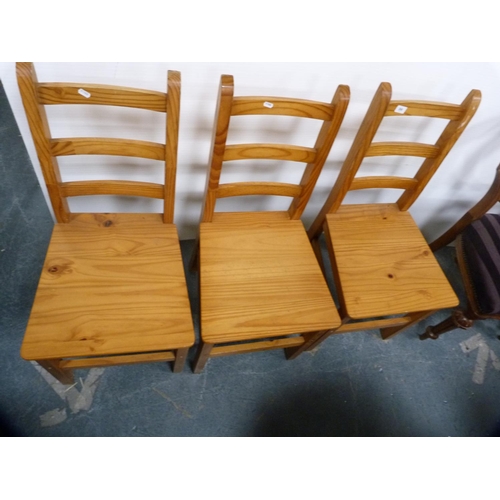 398 - Three pine kitchen chairs.