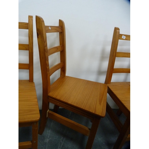 398 - Three pine kitchen chairs.