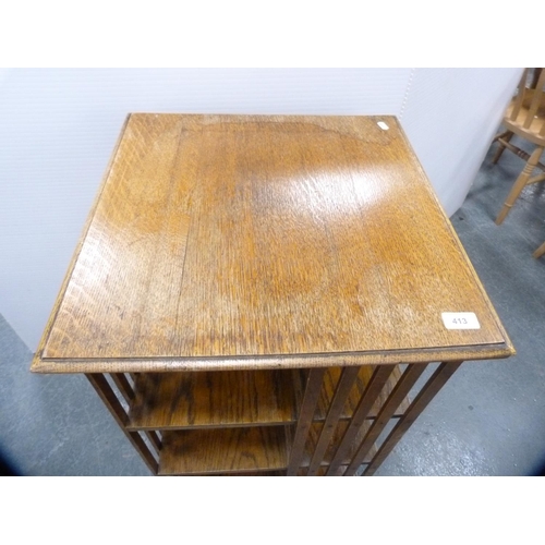 413 - Oak revolving bookcase.