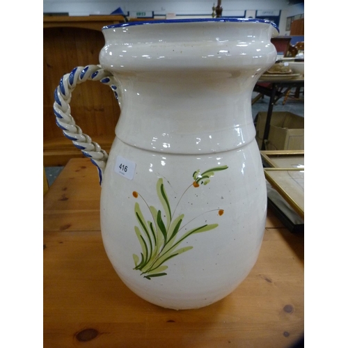 416 - Large pottery glazed jug.