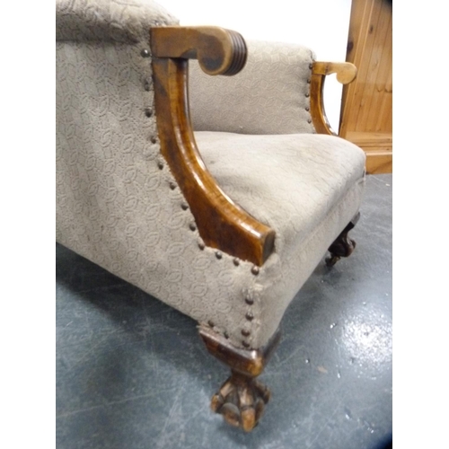 420 - Edwardian armchair on ball and claw supports.