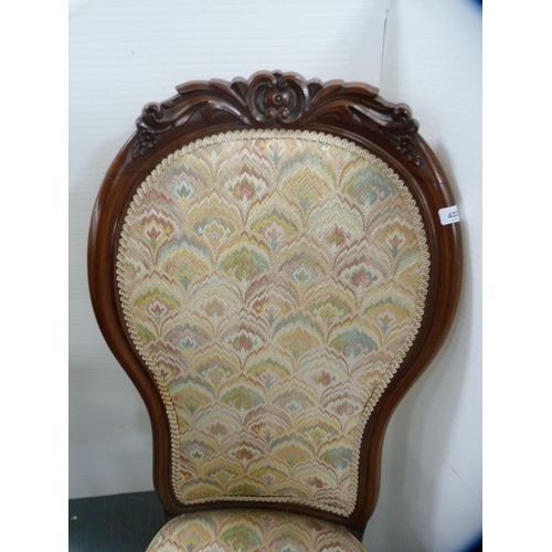 433 - Victorian mahogany spoon-back nursing chair, 110cm high.