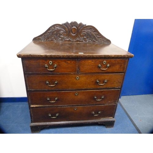 446 - Victorian oak chest of two short and three long drawers with carved back.