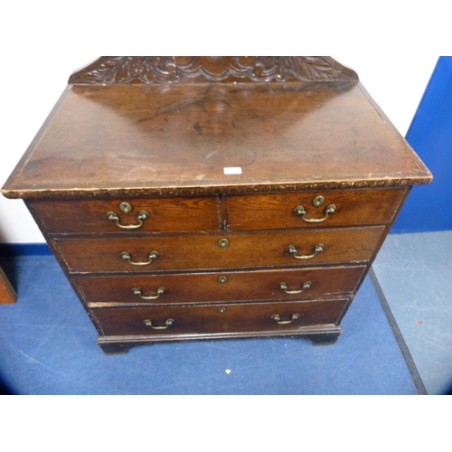 446 - Victorian oak chest of two short and three long drawers with carved back.