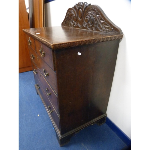 446 - Victorian oak chest of two short and three long drawers with carved back.