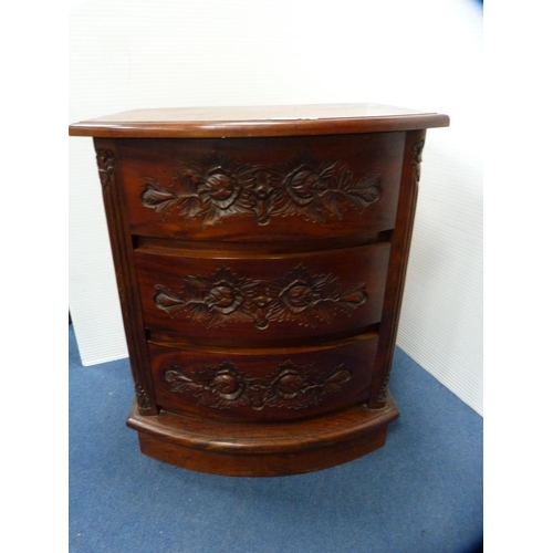 469 - Carved bow front chest of three drawers.