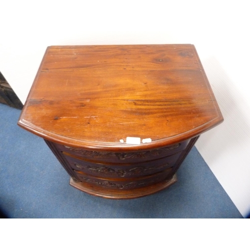 469 - Carved bow front chest of three drawers.