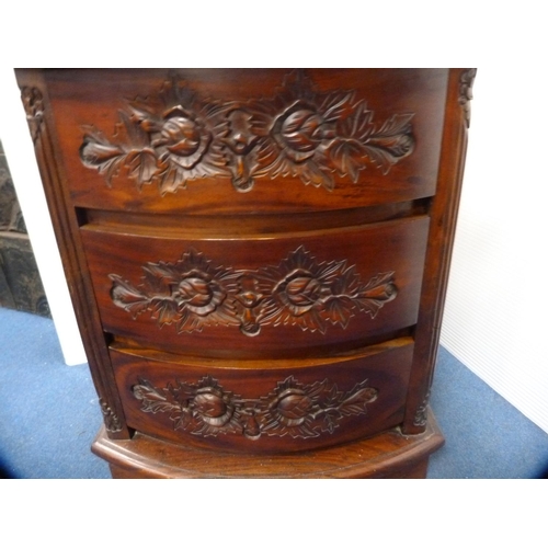 469 - Carved bow front chest of three drawers.